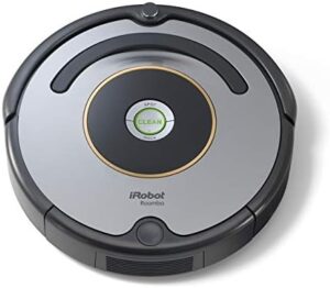 "Clean with ease using the Roomba 615 Vacuum Cleaner, a powerful and compact plastic device with 120W motor, perfect for grey surfaces."