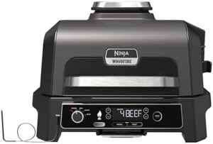 Here is the output meta description:

"Upgrade your outdoor cooking with the Ninja Woodfire Pro XL Electric BBQ Grill & Smoker. Large 4-in-1 grill, air fryer, and smoker for perfect results every time. Use woodfire pellets for a genuine BBQ taste. Get ready to cook up a storm!"