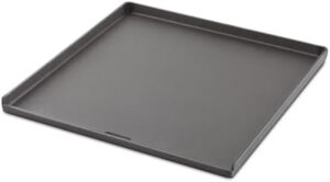 Here is the optimized SEO meta description:

"Experience cooking perfection with Weber's Crafted Plancha Grande GRUP ACCESORIOS 7682, a cast iron grill pan in sleek black. Perfect for searing meat and vegetables to perfection."