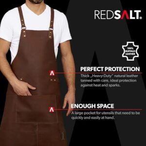 Protect your professional attire with the REDSALT Premium Leather Apron, crafted from 100% Buffalo Leather for durability. Ideal for BBQ, catering, and kitchen use, its dimensions are 84 x 62 cm.