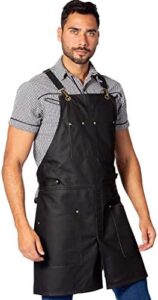 Stay protected and stylish with the Under NY Sky Leather Apron featuring crossback straps, tool pockets, and adjustable design perfect for pro chefs, bartenders, woodworkers, and makers.