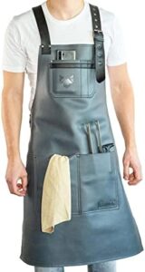 Protect your clothes and grill with the Fennek Barbeque Apron, made from durable leather for a stylish and practical cooking companion, perfect for any backyard barbecue or outdoor party.