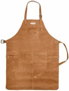 Upgrade your grilling game with the Drakensberg BBQ Apron 'Bob', made of genuine leather in a cognac-brown finish. Adjustable and featuring 3 handy pockets, perfect for men's gifts or professional use.