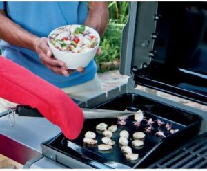 "Savory cooking just got a boost with the Spirit 300 Series Plancha Grill Plate, featuring a durable black finish and heat-resistant design. Cook up to 4 people with ease, perfect for family meals or outdoor gatherings."