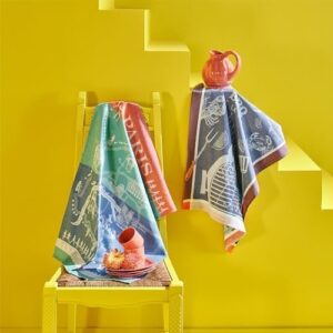 Here is the generated meta description:

"Wrap up your outdoor cooking with Garnier Thiebaut's De La Mer Bleu French Kitchen Towel, featuring 22x30 inches of soft cotton and Jacquard weaving. Perfect for BBQs and picnics!"