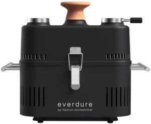 "Experience outdoor grilling like a pro with the Everdure by Heston Blumenthal Cube 360 Portable Charcoal Grill. Perfect for camping trips or backyard barbecues, this grill features a hood and thermometer for easy temperature control, and is available in sleek black."