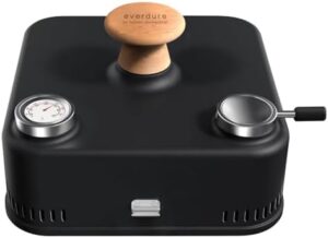"Experience outdoor grilling like a pro with the Everdure by Heston Blumenthal Cube 360 Portable Charcoal Grill. Perfect for camping trips or backyard barbecues, this grill features a hood and thermometer for easy temperature control, and is available in sleek black."