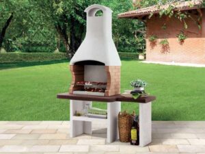 Enhance your outdoor gatherings with Jesolo 2's charcoal BBQ grill and side table, featuring a durable stone design by Palazzetti. Perfect for garden use, enjoy quality cooking and ample space.